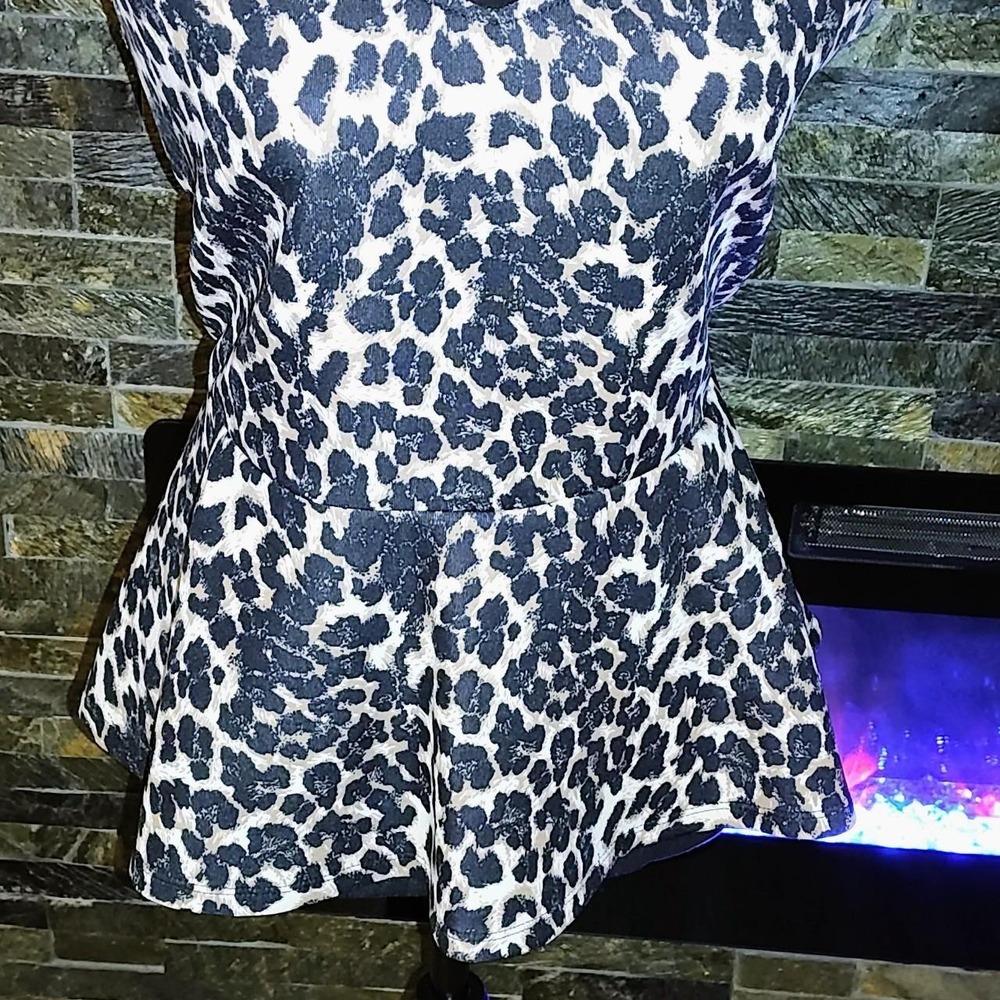 Stretchy cheetah Print Top with peplum Size XL